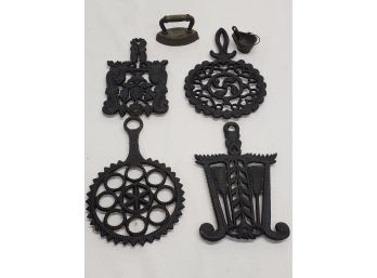 Assortment Of Cast Iron Trivets & Decorative Items