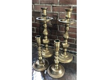 Two Pairs Of Brass Candlesticks