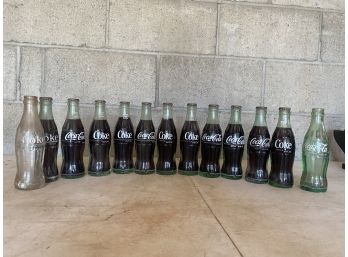 Group Of 13 Glass Coca-Cola Bottles