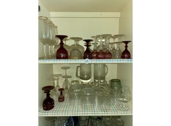TWO SHELVES VINTAGE GLASSWARE INCLUDING CRANBERRY CUT TO CLEAR, TUMBLERS, ROCKS GLASSES