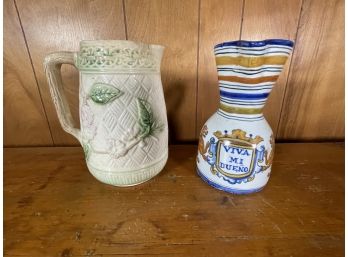 A MAJOLICA PITCHER AND AN ITALIAN MAJOLICA PITCHER