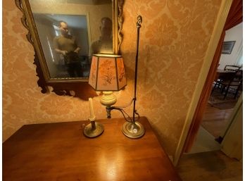 AN ADJUSTABLE ANTIQUE TOLL LAMP AND A PUSH UP BRASS CANDLESTICK HOLDER