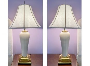 Pair Of White Glazed Ceramic Urn Motif Lamps With A Tiered Brass Base And Paneled Fabric Bell Shade
