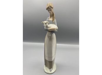 10 1/4' Lladro Porcelain Figuring Girl Holding Lamb