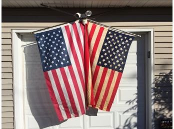 Two Vintage American Flags On Poles. Both Show Minor Wear.