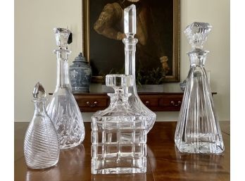 A Collection Of Crystal And Glass Decanters