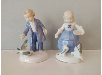 Boy And Girl Porcelain Figures With Birds