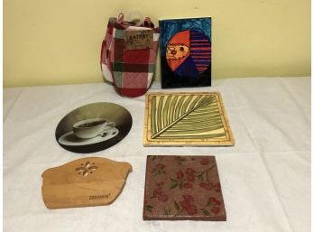 Five Trivets And A Pair Of Oven Mitts