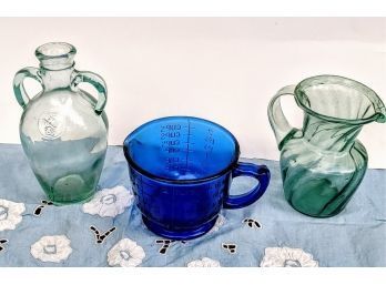 Blue 2 Cup Measuring Cup, Green Glass Jug, And Green Glass Pitcher