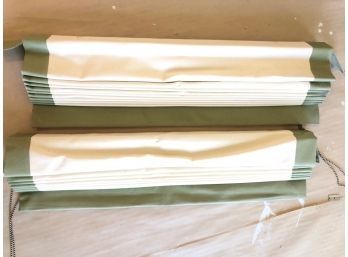 A Pair Of Cream And Green Trimmed Roman Shades From The Shade Store
