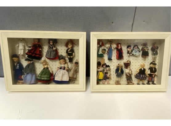 Collection Of Dolls Mounted In Display Cases