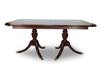 A Banded Mahogany Extendable Dining Table