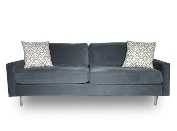 A Velvet Upholstered Modern Couch By CB2