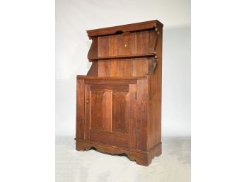 A Rustic Wood Cabinet With Hutch Top (built In)
