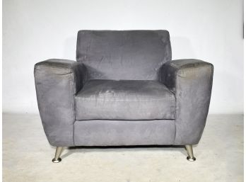 A Modern Arm Chair In Suede And Chrome