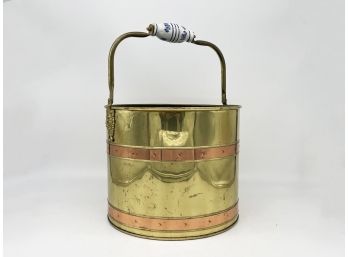 A Large Brass And Copper Banded Bucket With Delft Handle