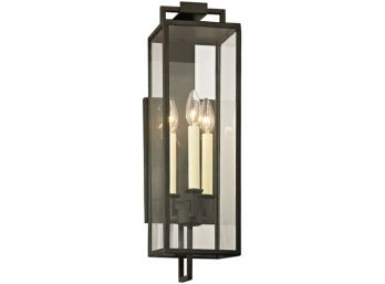 A Forged Iron Wall Sconce By Troy Lighting