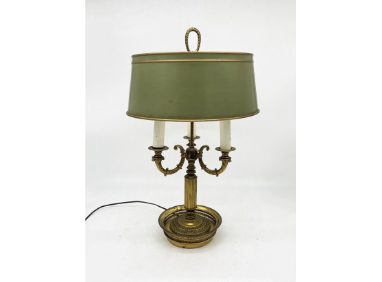 A Vintage Brass Lamp With Metal Shade