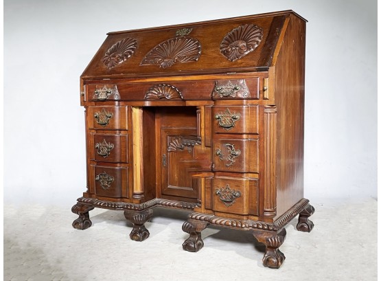 A Carved Mahogany Chippendale Style Secretary Desk