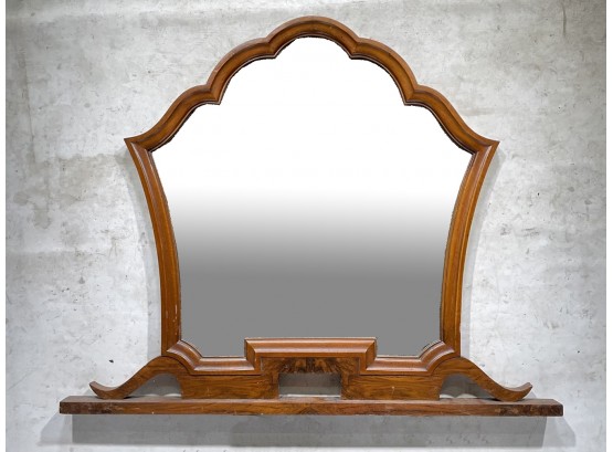 A Large, Carved Wood Framed Beveled Mirror