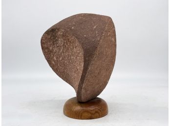 A Vintage Stone Sculpture On Wood Base