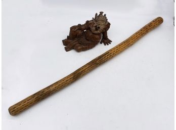 A Rainstick And Carved Indian Figure