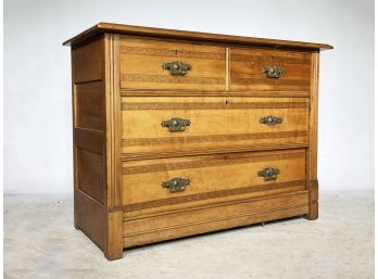 A Victorian Carved Maple Chest Of Drawers