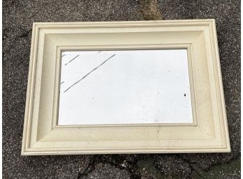 A Large Painted Wood Framed Beveled Mirror