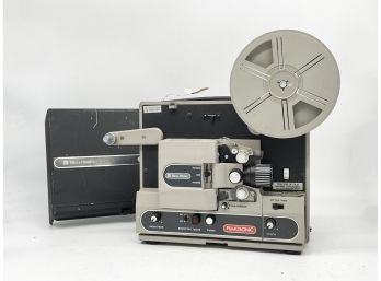 A Vintage Bell & Howell Filmosonic Projector And Accessories