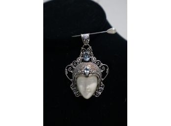 925 Sterling Silver With Light Blue Stones And Carved Face Pendant Signed 'NF' Indonesia