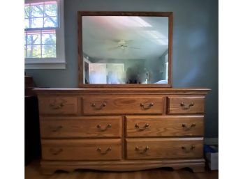 A Traditional Oak Long Dresser With Mirror