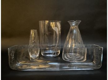 A Small Collection Of Clear Glass Vessels