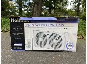 A Holmes Classic Twin Window Fan