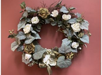 A Handmade Faux Floral Arrangement On A Stick Wreath