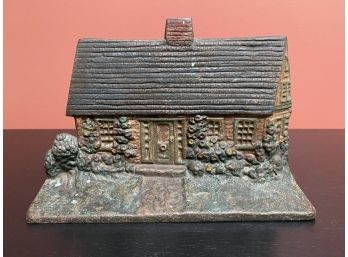 A Vintage Cast-Iron Cottage Doorstop