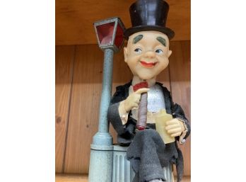 Vintage Character Sitting On A Garbage Can Next To A Lamp Post With A Bottle And Cigar Not Battery Operated