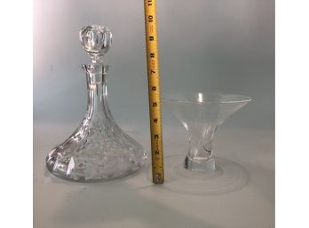 A Decanter With Age And A Vase