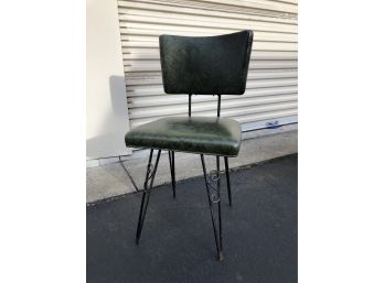 A Vintage Naugahyde And Metal Scroll Leg Chair