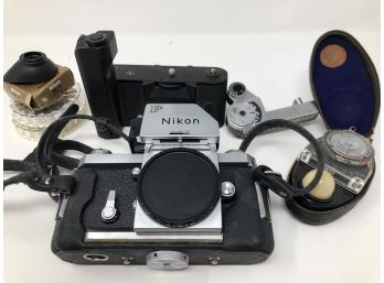 A Vintage Nikon Camera And Equipment In A Case