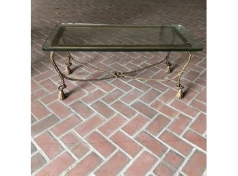 A Hollywood Regency Iron Gilt Rope And Tassel Coffee Table With Thick Glass Top