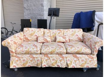 An 89' Exaggerated Scroll Arm Linen Slipcovered 3 Cushion Sofa