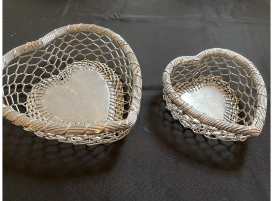 A Set Of Two  Woven Metal Wire Hearth Shaped Baskets.