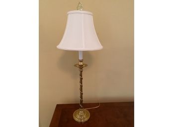 A Brass Candlestick Table Lamp With Shade