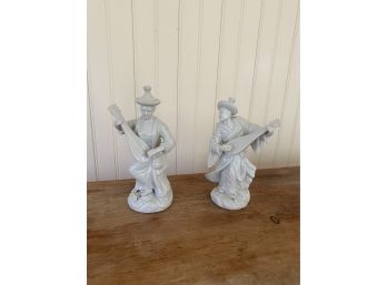 A Blanc De China Figurines Playing Instruments Pair