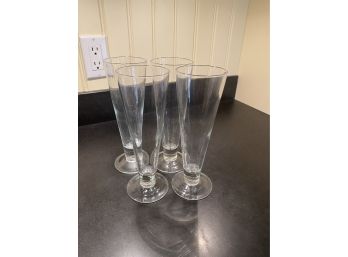 A Set Of Four Footed Pilsner Glass