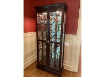 A  Mahogany Lighted Mirrored Back Curio Cabinet By Stickley