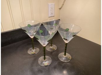 A Set Of Four Hand Decorated Martini Glasses