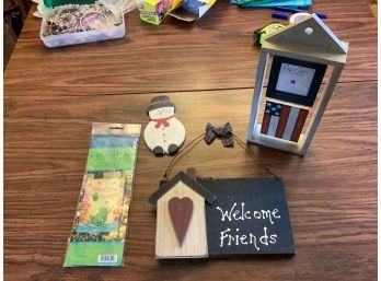 Lot Of Decorative Wood Items Including A Snowman, Welcome Friends Sign, Garden Flag And Unique Photo Frame.