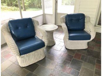 A Pair Of Vintage Wicker Arm Chairs And A Round Drinks Table