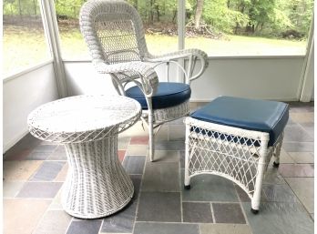 A Vintage Wicker Arm Chair, Ottoman And Drinks Table